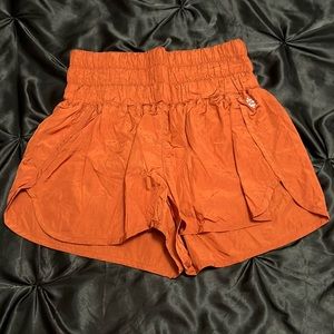 flowy shorts, high rise, brand is free people.